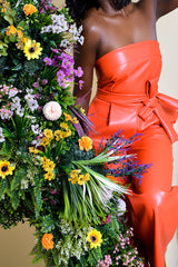 JORDAN WIDE LEG FAUX LEATHER JUMPSUIT IN CORAL