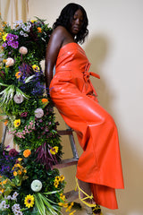 JORDAN WIDE LEG FAUX LEATHER JUMPSUIT IN CORAL