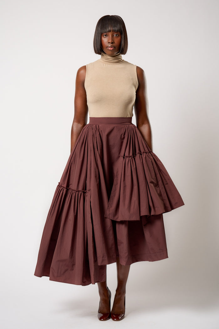 CALAIS ASYMMETRIC WIND BREAKER SKIRT IN BROWN – THE KEMIST
