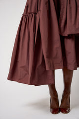 CALAIS ASYMMETRIC WIND BREAKER SKIRT IN BROWN