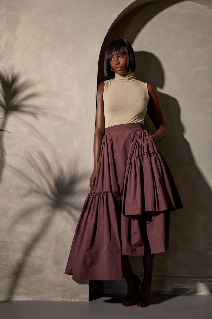 CALAIS ASYMMETRIC WIND BREAKER SKIRT IN BROWN – THE KEMIST