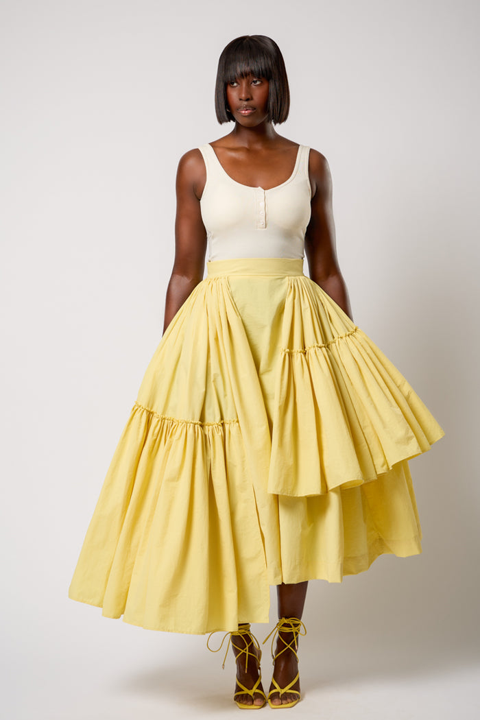 CALAIS ASYMMETRIC WIND BREAKER SKIRT IN YELLOW – THE KEMIST