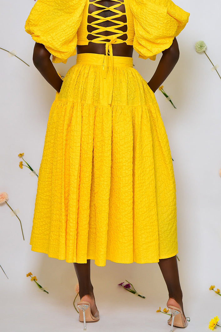 BASTIA PLEATED MIDI SKIRT IN YELLOW