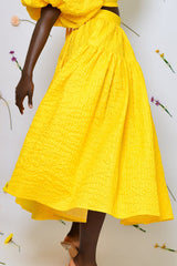 BASTIA PLEATED MIDI SKIRT IN YELLOW