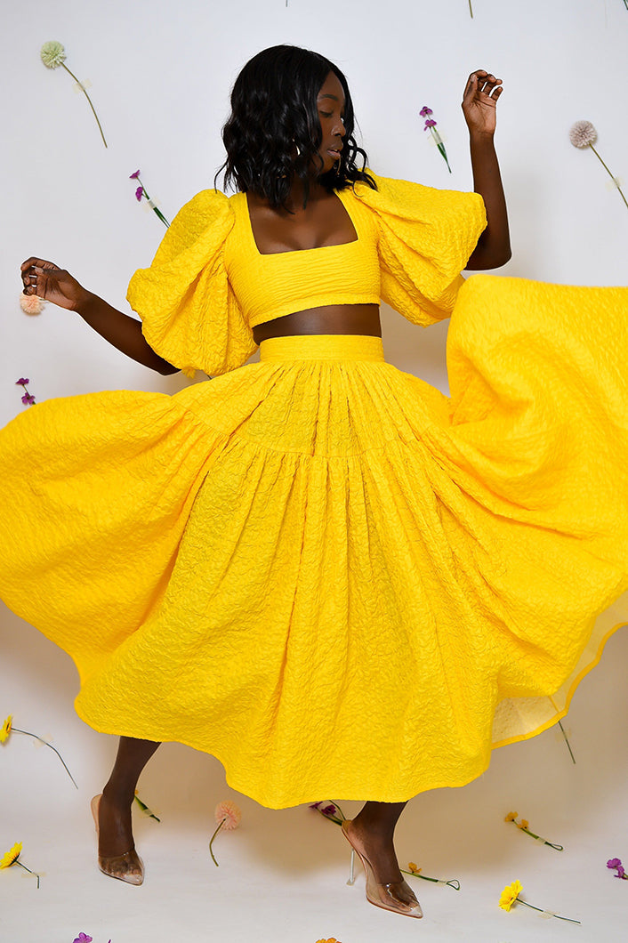 BASTIA PLEATED MIDI SKIRT IN YELLOW