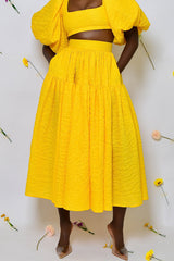 BASTIA PLEATED MIDI SKIRT IN YELLOW
