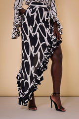 SITGES RUFFLED ASYMMETRIC SKIRT IN CHARCOAL TK SCRIPT